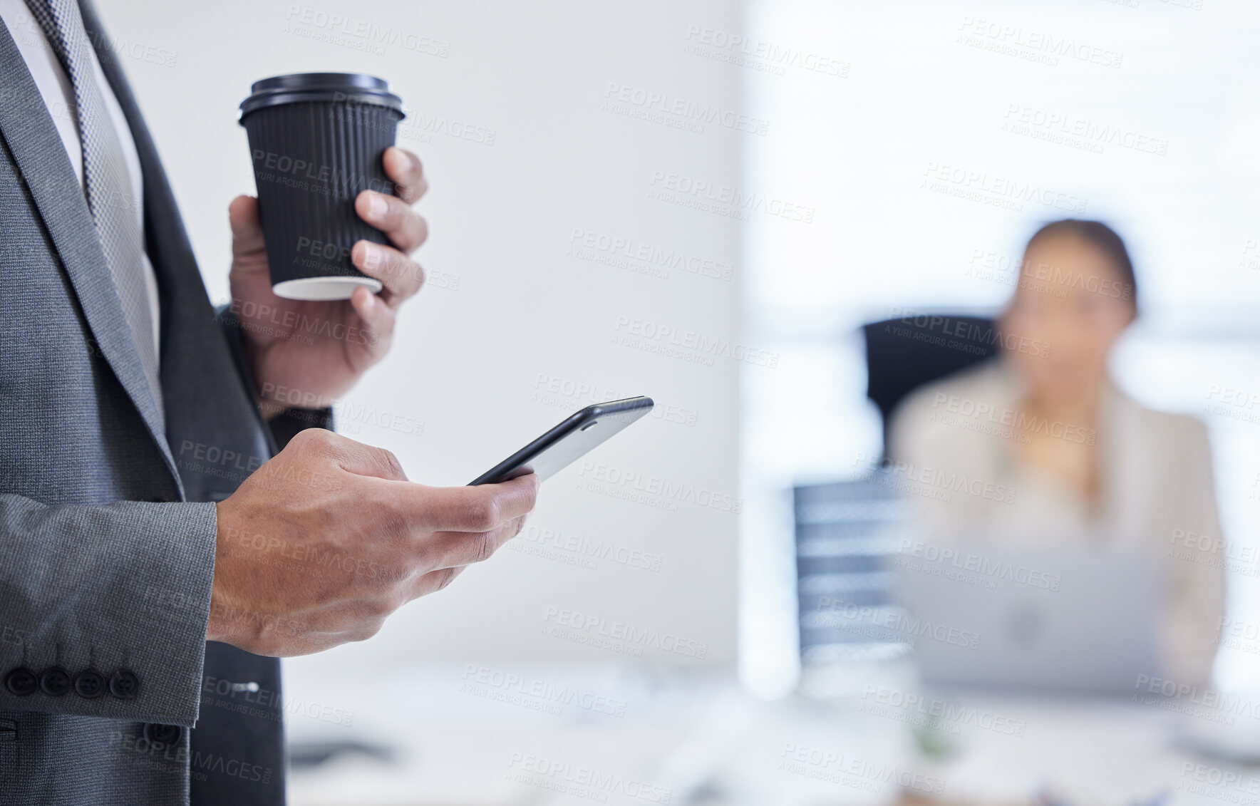 Buy stock photo Shot of an unrecognisable businessman using a smartphone and having coffee during a meeting in a modern office