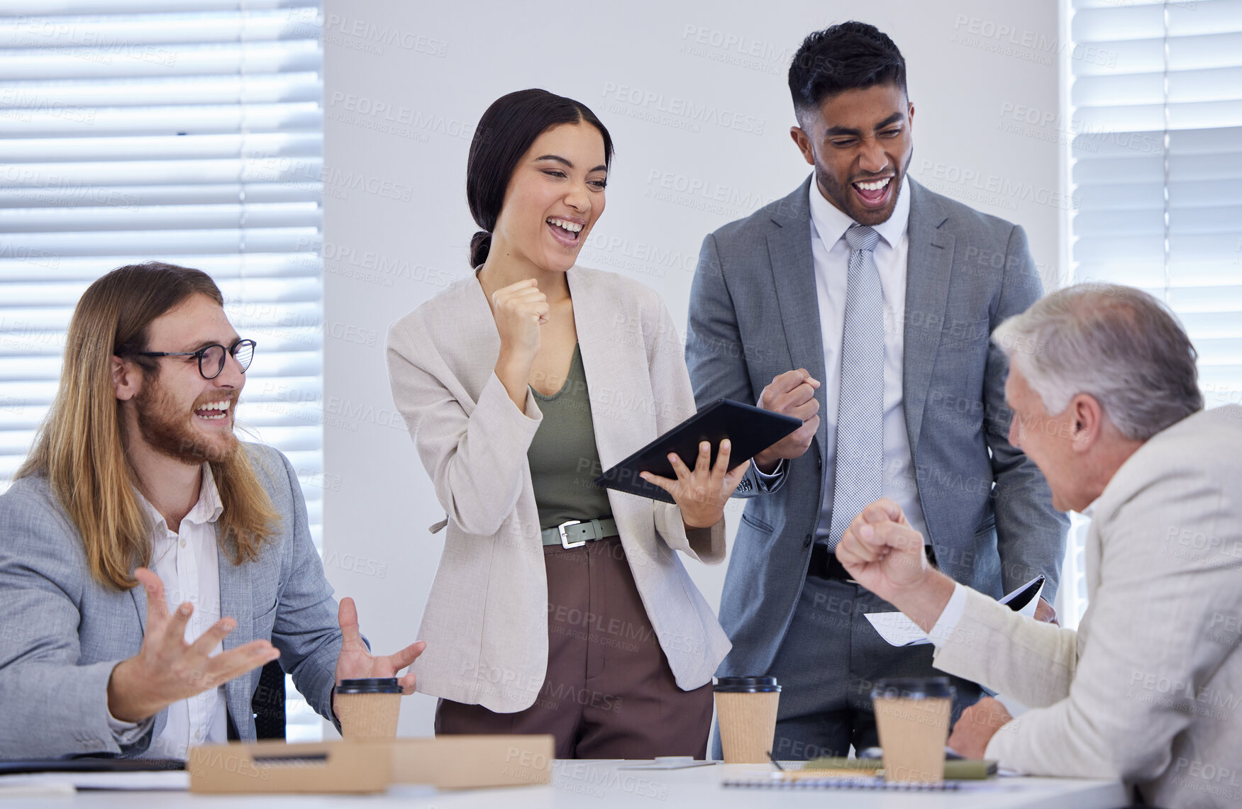 Buy stock photo Shot of a group of businesspeople cheering during a meeting in a modern office