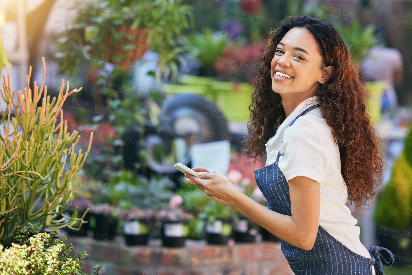 Buy stock photo Woman, plants and smile in nursery with phone, online search or growth for sustainable botany app or eco friendly. Houseplant, leaves or organic nature for small business, horticulture or gardener