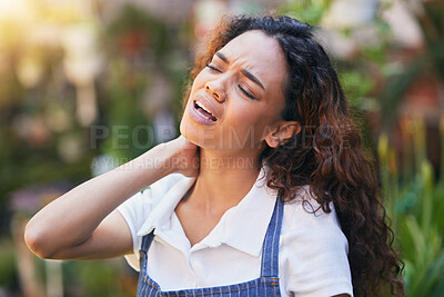 Buy stock photo Shot of a young business owner massaging her neck
