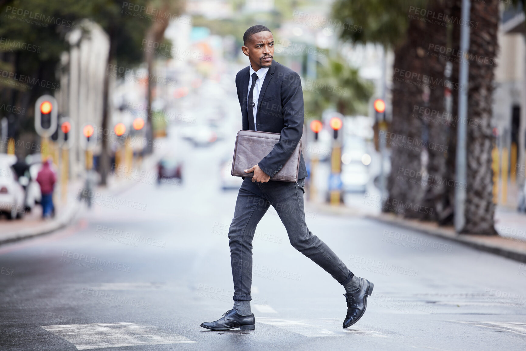 Buy stock photo Urban, street and black man for crossing road, city and commute to meeting. Professional, travel and walking across  for corporate lawyer, suit and pedestrian for serious businessman with briefcase