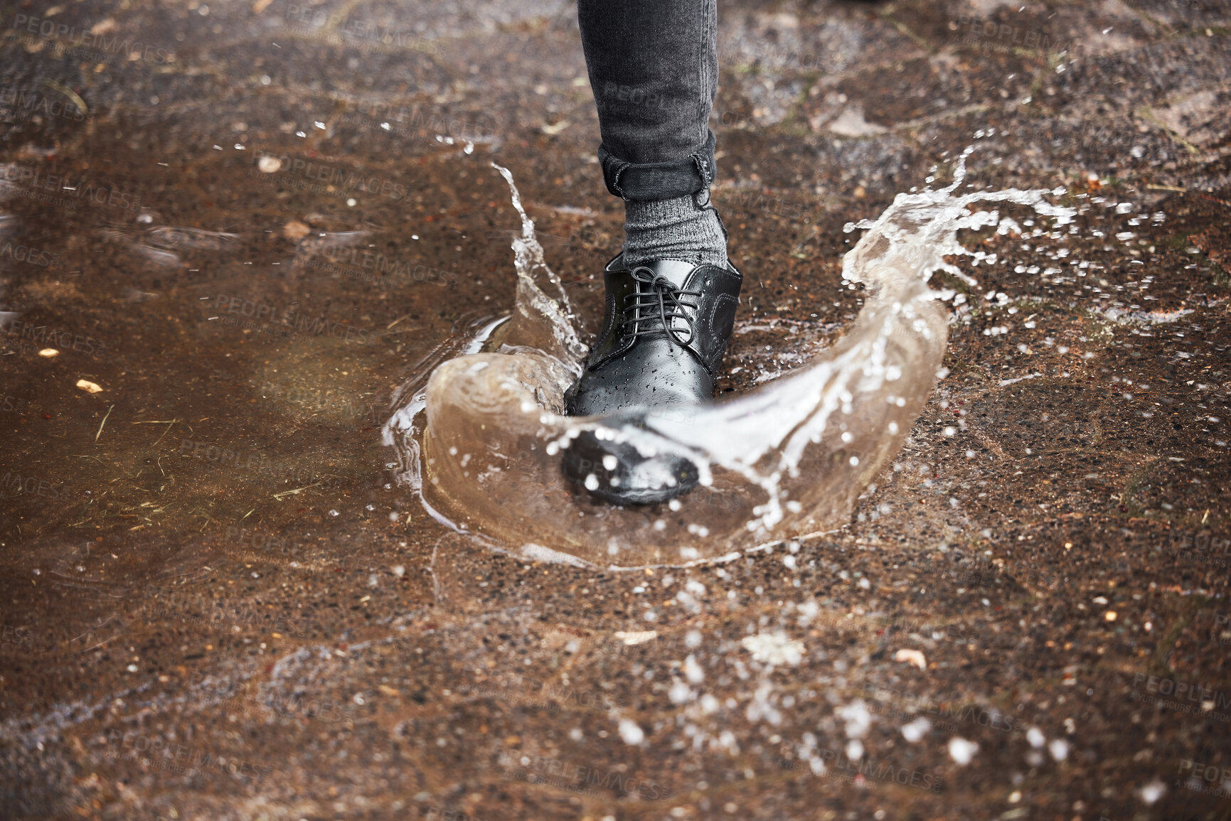 Buy stock photo Puddle, shoe and business person stepping in water on ground for commute to work on winter morning. Splash, street and wet footwear with employee in city for accident, mistake or fail from above