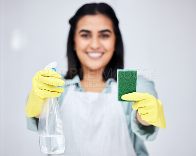 Buy stock photo Blur, hands and woman with spray bottle or sponge for bacteria, cleaner or dirty furniture in studio. Grey background, maid or proud janitor ready to start washing with product, liquid soap or gloves