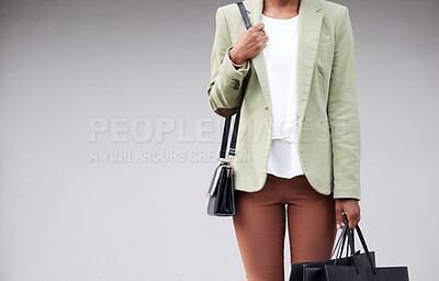 Buy stock photo Black woman, studio and bags for shopping with retail package, fashion boutique and store sale for mockup. African female customer, grey background and space with discount for luxury clothes and gift