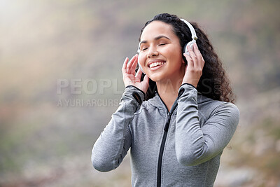 Buy stock photo Headphones, woman or calm runner in nature streaming music to start training, workout or exercise. Happy, outdoor or healthy sports athlete on break listening to radio or fitness podcast to relax