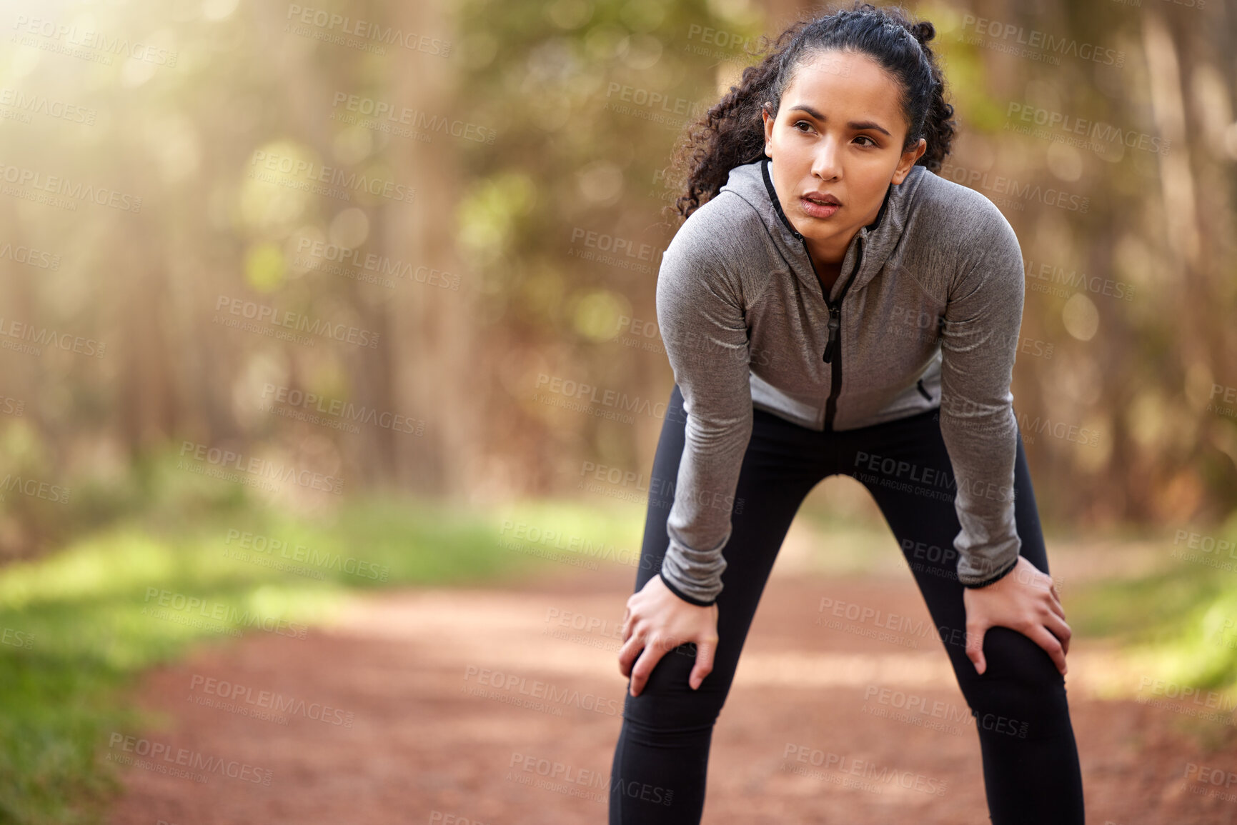 Buy stock photo Woman, resting and thinking in nature for exercise, fitness and wellness in forest. Brazilian runner, taking break and breathing from workout, challenge and goals in woods in morning with copy space