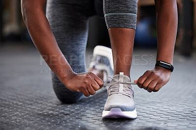 Buy stock photo Hands, shoelaces or shoes at gym with woman, fitness or starting workout, wellness or training. Ready, footwear closeup or girl with sneakers for exercise, performance or health motivation in studio
