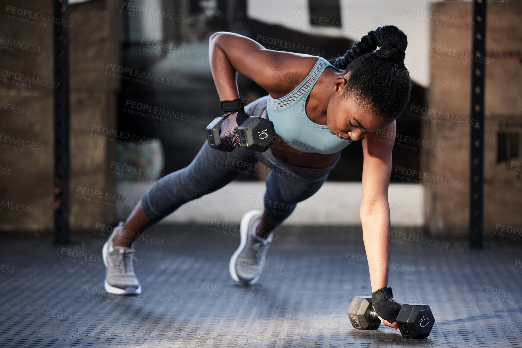 Buy stock photo Gym workout, dumbbells and a black woman on the floor for fitness, exercise and training for sports. Strong, healthy and an African athlete with weights for strength, muscle and health at a club