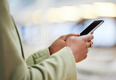 Buy stock photo Shot of a woman using her smartphone to send a text