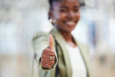 Buy stock photo Shot of a young woman giving the thumbs up while shopping