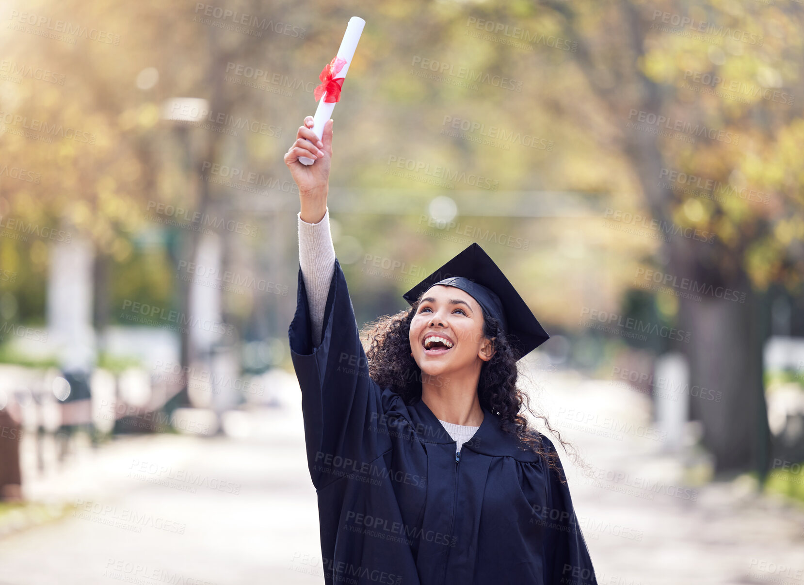 Buy stock photo Success, university woman graduate and celebration outdoors with her certificate. Achievement or victory, college and happy student cheering for education on her graduation day with a lens flare