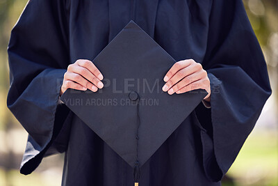 Buy stock photo Shot of an unrecognisable woman holding her graduation cap at university