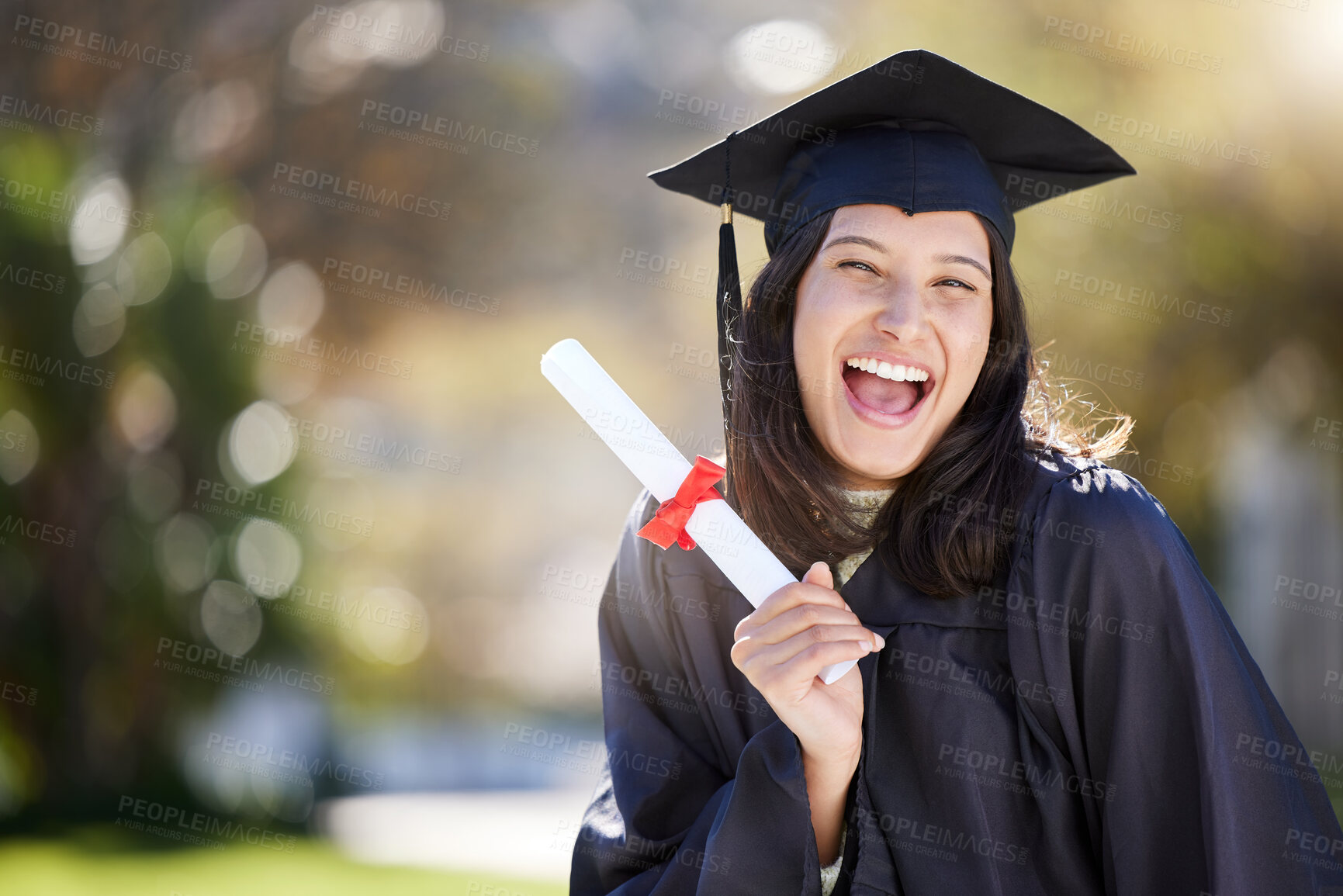 Buy stock photo Cropped portrait of an attractive young female student celebrating on graduation day