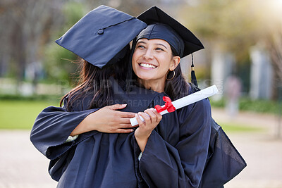 Buy stock photo Graduate, education and woman friends hugging at a university event on campus for celebration. Graduation, certificate and hug with female students together in support of a scholarship achievement