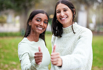 Buy stock photo Young women, thumbs up and university students happy for education or yes for academic study or success portrait and on mock up. Agreement, female scholars and smile or achieve in new york campus

