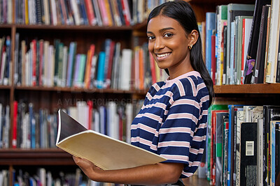 Buy stock photo Girl, university student and books in library for portrait with smile for education, development or study at campus. Indian woman, person and happy for research, course or reading for info at college