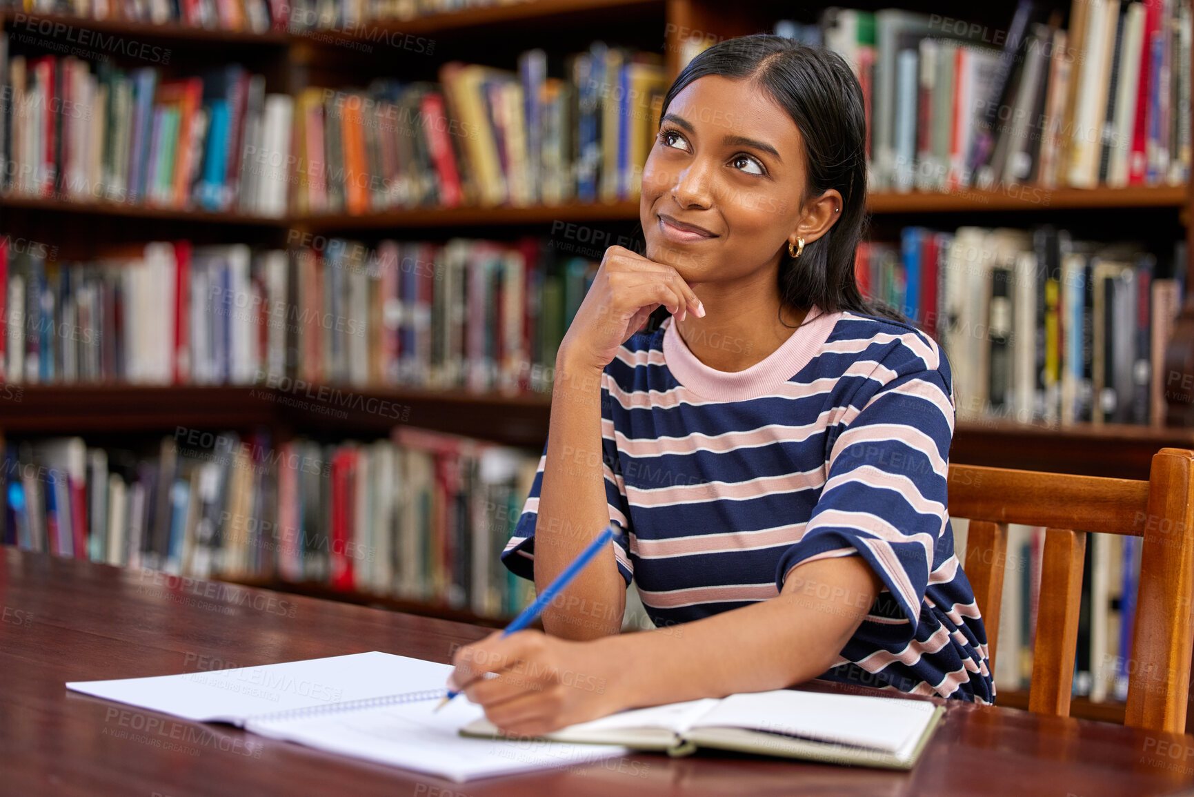 Buy stock photo College, thinking and woman student in library with notebook for education, learning or studying for exam. Scholar, writing and Indian person in thought for idea, knowledge or test on biology course