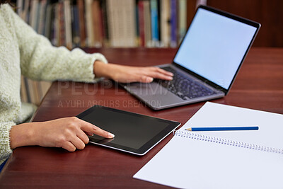 Buy stock photo Shot of a unrecognizable female using a laptop in a library