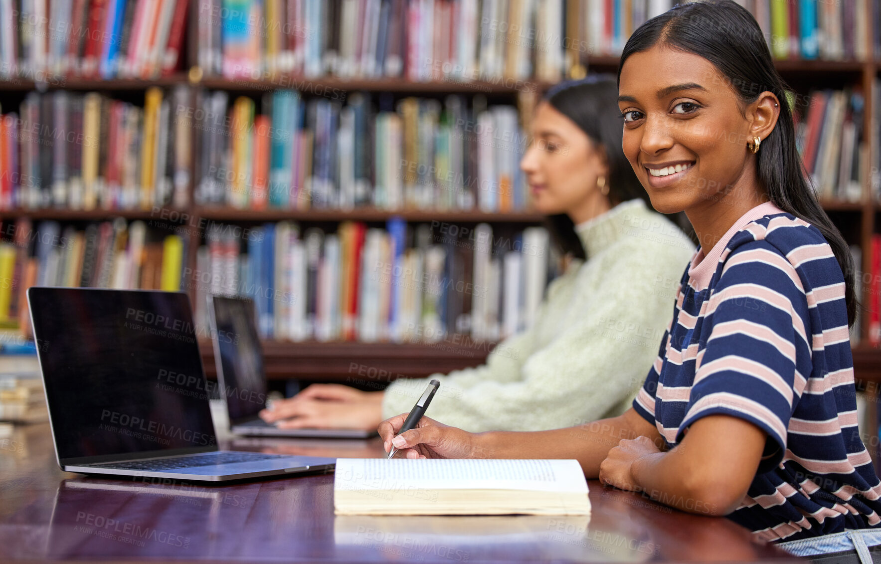 Buy stock photo Portrait, university and woman in library with laptop, research and writing notes with bookshelf. Smile, book and student with notebook for scholarship, study and opportunity for college education