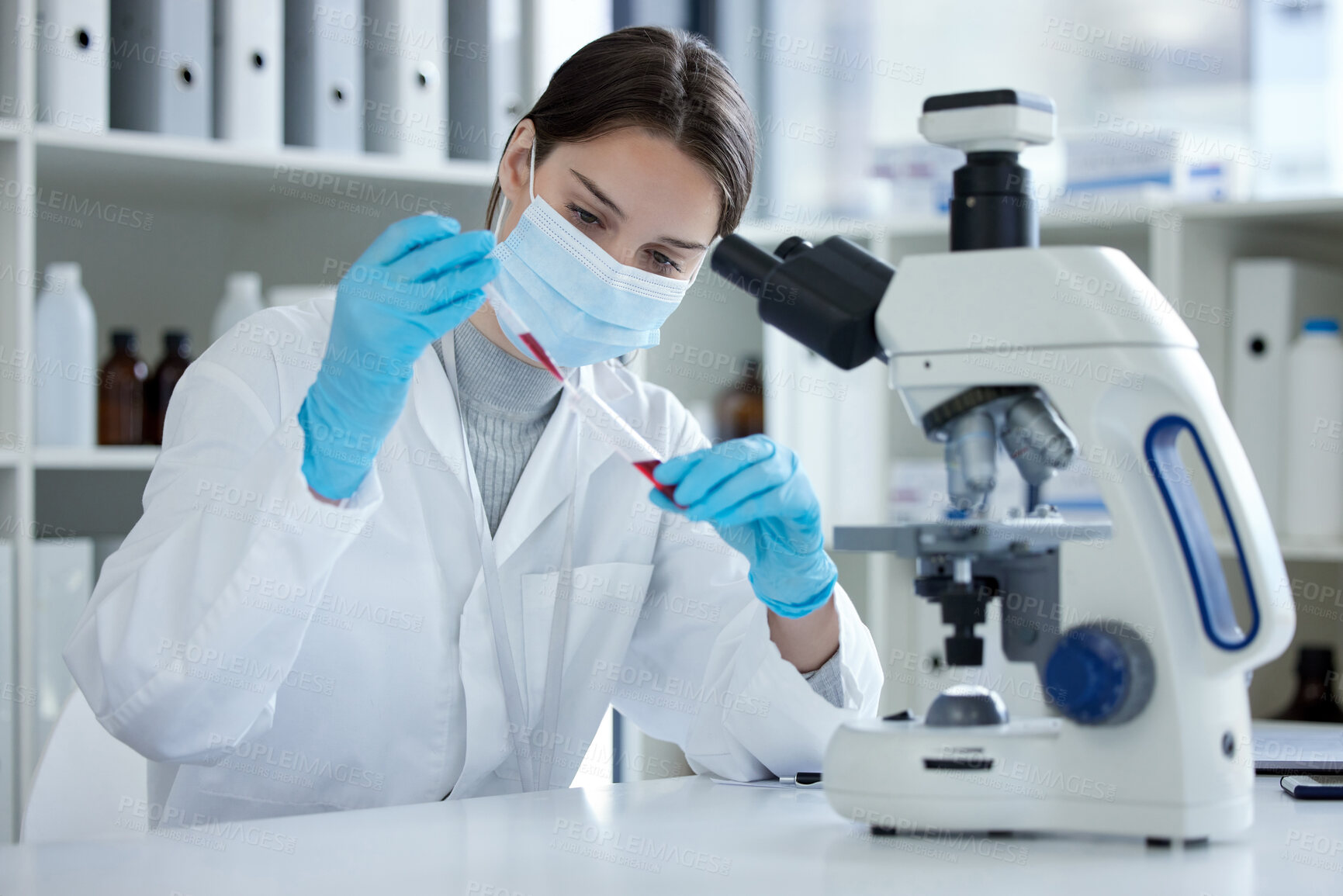 Buy stock photo Science, test tube and woman with microscope, mask and medical research in laboratory. Vaccine innovation, scientist or lab technician in healthcare, medicine or pharmaceutical development with blood