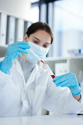 Buy stock photo Closeup shot of a young woman using a dropper and test tube while working with samples in a lab
