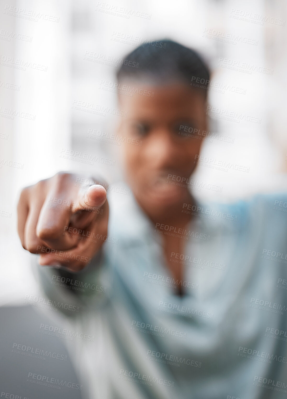 Buy stock photo Shot of an unrecognizable woman pointing with her hand outside