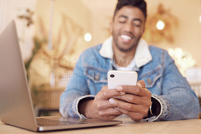 Buy stock photo Mobile phone, relax and happy man in cafe for social media, communication or networking. Online, notification and hands of person with laptop for browsing internet, trending update or lunch break