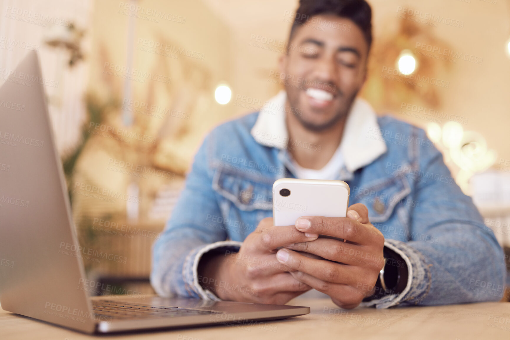 Buy stock photo Mobile phone, relax and happy man in cafe for social media, communication or networking. Online, notification and hands of person with laptop for browsing internet, trending update or lunch break