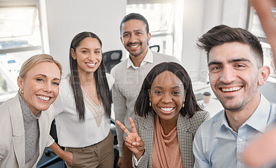 Buy stock photo Shot of a group of colleagues taking a selfie in a office