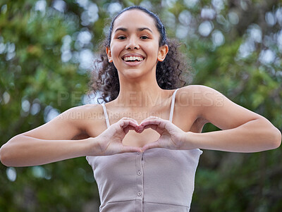 Buy stock photo Girl, portrait and confident in nature for heart hands, trees and smile in park for weekend trip. Female person, emoji and proud of peace or kindness in garden, vacation and love by plants in outdoor