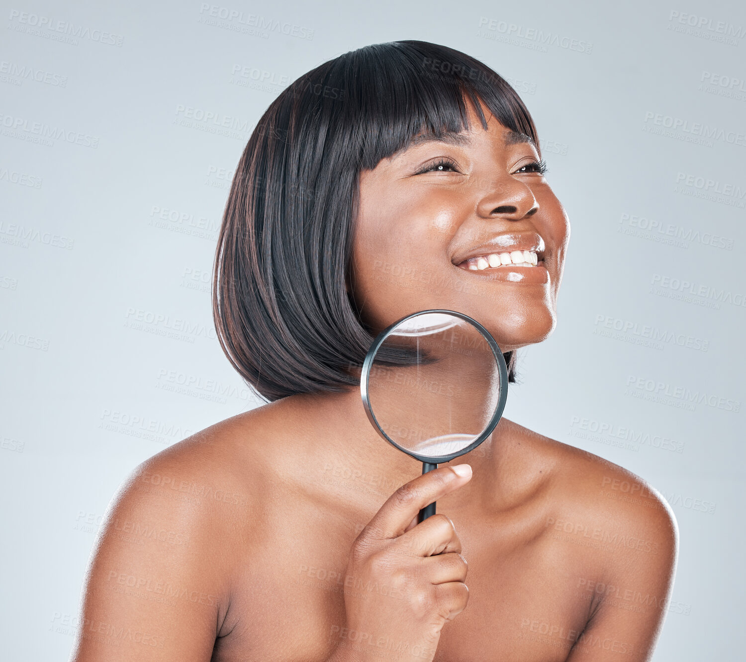 Buy stock photo Magnifying glass, skincare and face of black woman in studio for beauty, wellness and facial treatment. Dermatology, salon and person with lens for health, cosmetics and analysis on white background