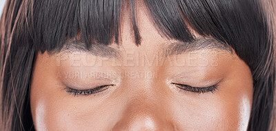 Buy stock photo Shot of an attractive young woman’s eyes closed against a studio background