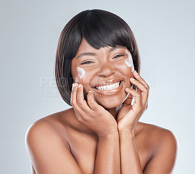Buy stock photo Skincare, happy and black woman with face cream application in studio for wellness, shine or cosmetics on grey background. Beauty, sunscreen and portrait with anti aging, lotion or collagen facial