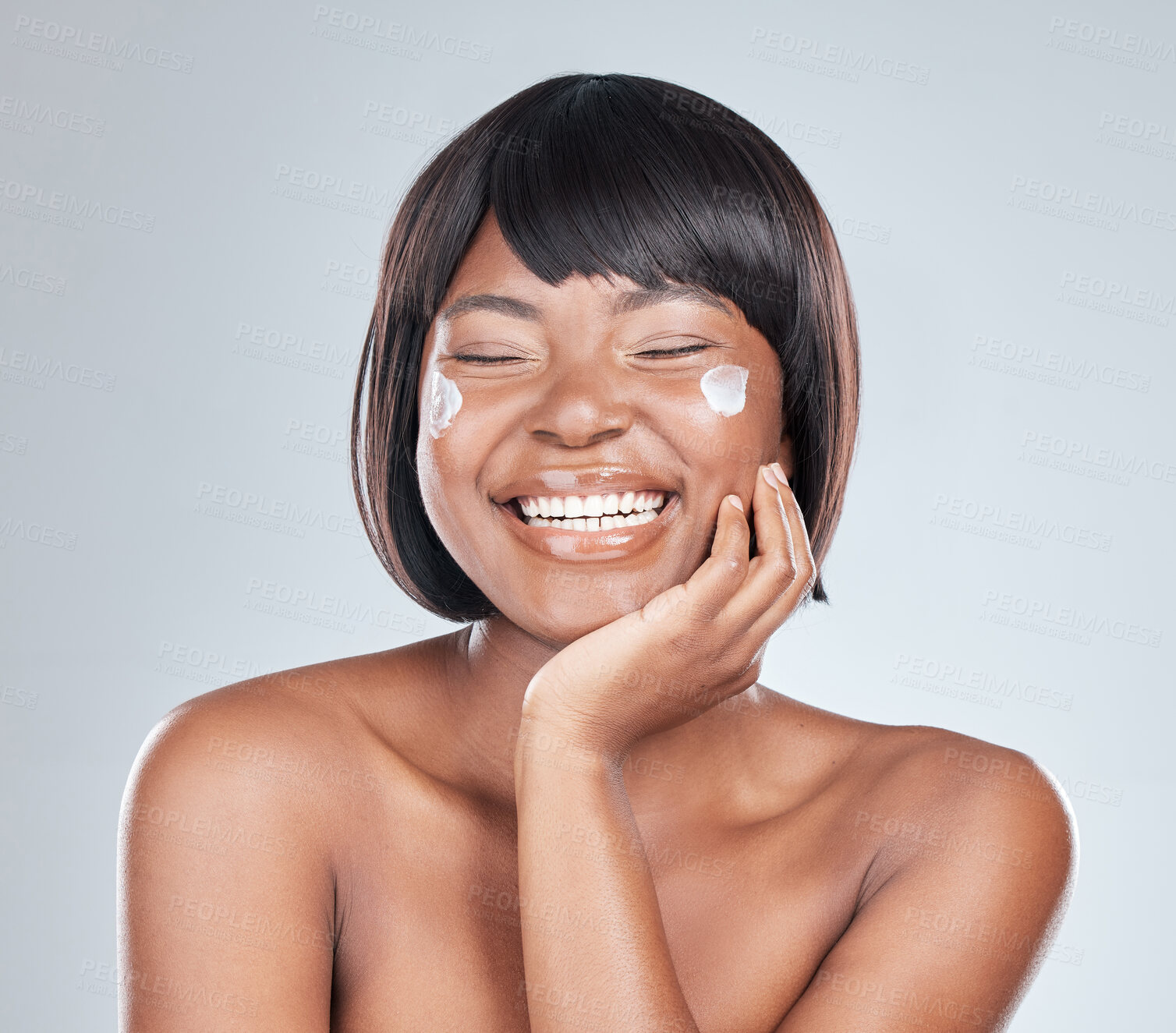 Buy stock photo Happy black woman, skincare and beauty with cream for facial treatment or moisturizer on a white studio background. African, female person or model with smile for lotion, cosmetics or healthy skin