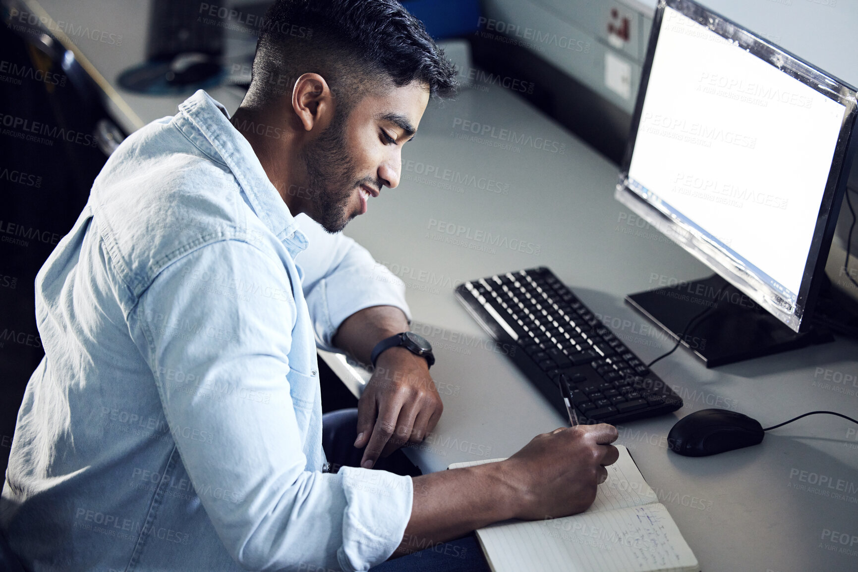 Buy stock photo Computer, student or young man writing in book for education, learning and studying in college. Male person, technology or pc in university for internet research, communication and connection