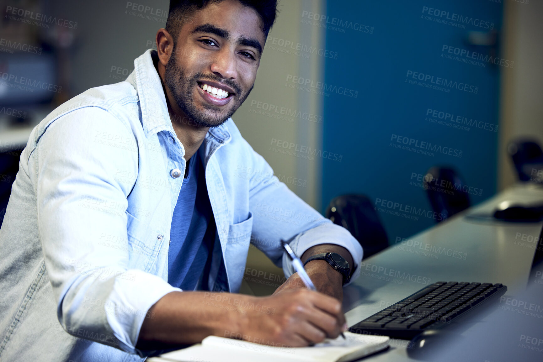 Buy stock photo Portrait, male student and writing in notebook with keyboard for course in cybersecurity, IT or science. Man, smile and tech in studying for exam at college, school or university in computer lab 