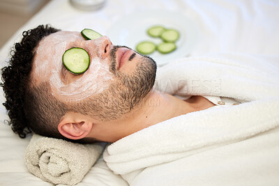 Buy stock photo Skincare, face mask and man in spa with cucumber for vegan beauty, skin glow and dermatology therapy. Male client, facial cream and acne detox in salon for self care, anti aging and luxury aesthetic