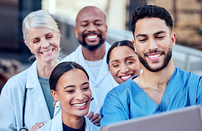 Buy stock photo Shot of a group of doctors taking a selfie in the city