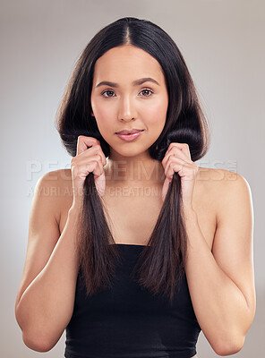 Buy stock photo Results, strong and haircare for woman in studio, healthy and aesthetic of hair, hand and confidence. Texture, salon treatment and growth for girl, hairstyle and proud, portrait and routine in Egypt