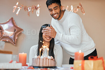 Buy stock photo Shot of a young couple celebrating a birthday at home