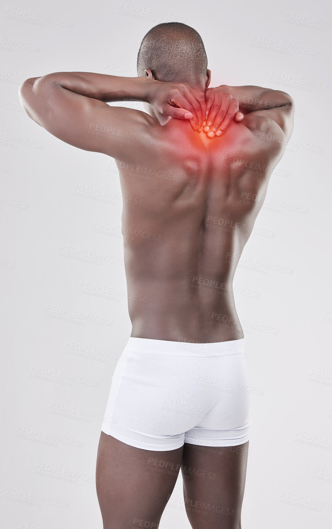 Buy stock photo Black man, back pain and injury with red glow for stress, muscle tension or bruise on a white studio background. Rear view, young African or model with sore spine, ache or inflammation from accident