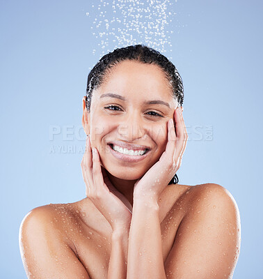 Buy stock photo Portrait, shower and skincare with smile of woman in studio isolated on blue background for hydration. Beauty, face and natural hygiene with happy model washing in bathroom and water for wellness