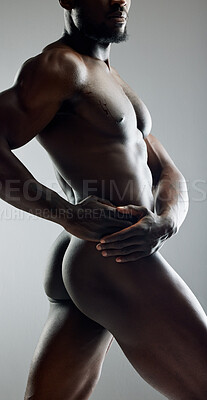 Buy stock photo Shot of a unrecognizable muscular man posing nude in studio against a grey background