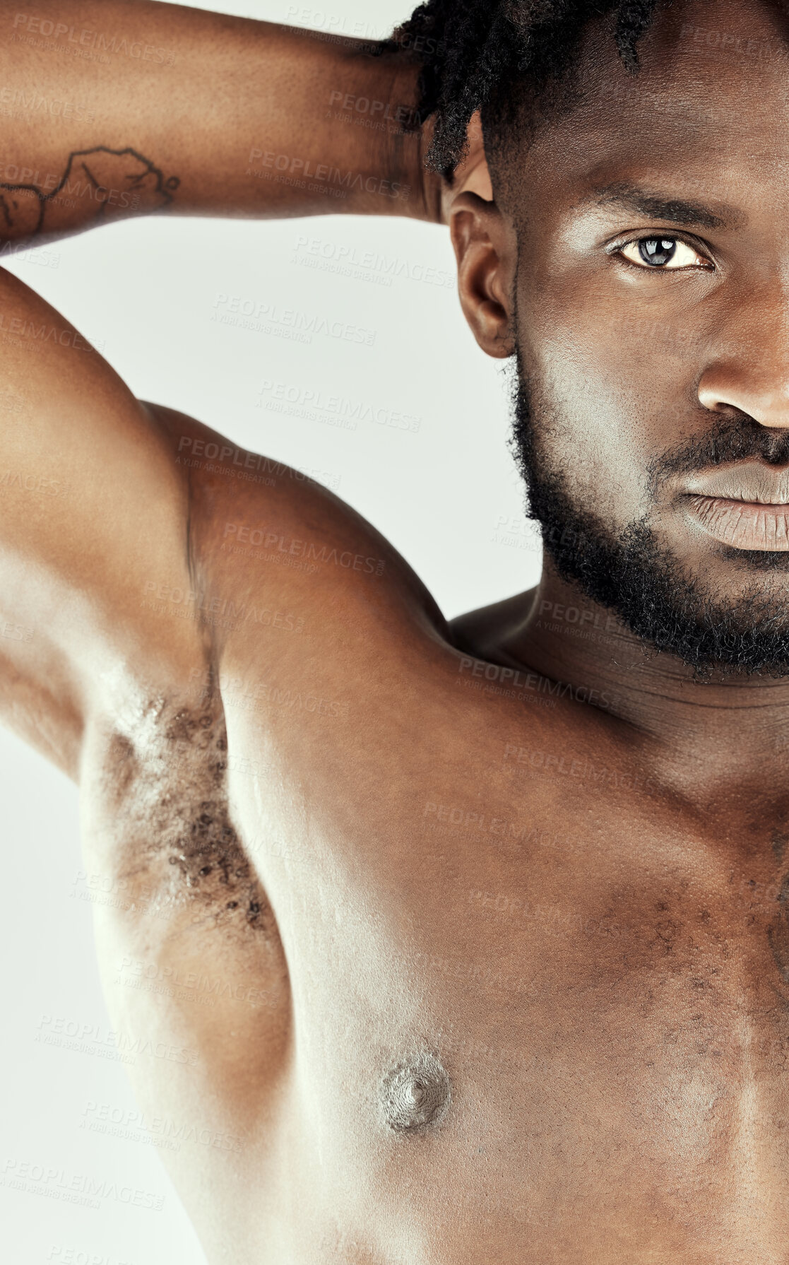 Buy stock photo Studio shot of a muscular young man posing shirtless