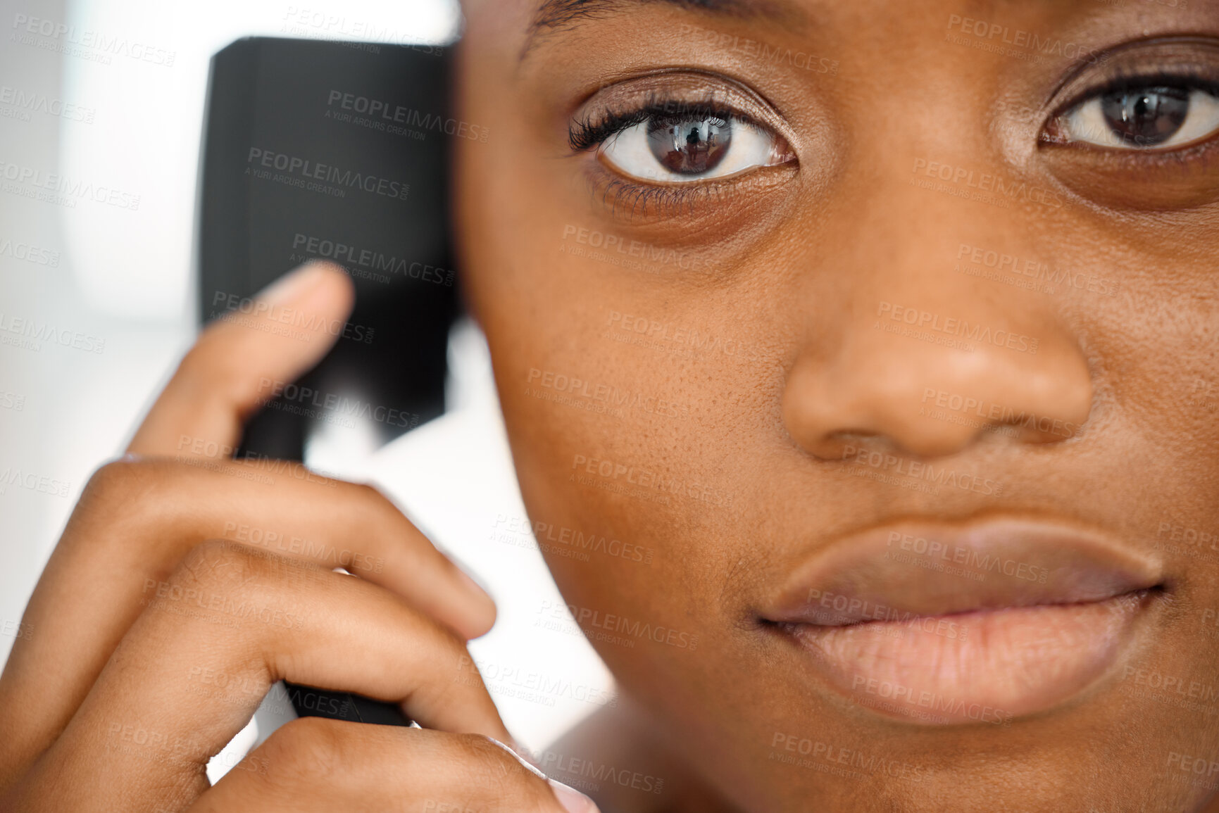 Buy stock photo Shot of a young woman on a call at work