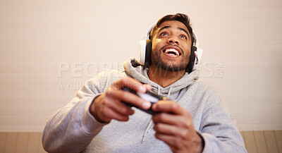Buy stock photo Man play video games, headphones and controller for esports, online streaming and happy at home. Male gamer, smile with entertainment and excited about gaming competition, tech and cyber streamer