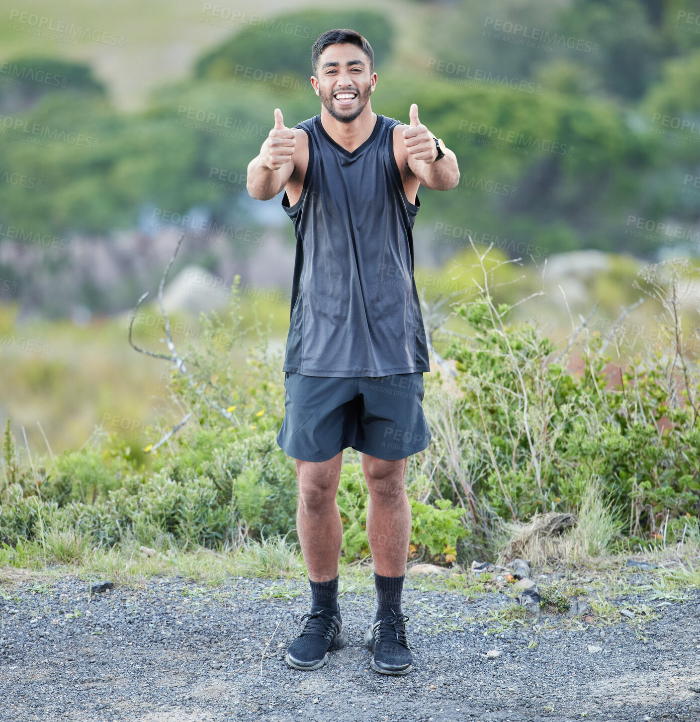 Buy stock photo Runner, thumbs up or portrait of happy man in nature training, running exercise or workout for wellness. Proud, motivation or healthy sports athlete with fitness in forest, park or woods with smile