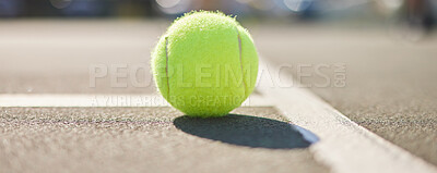 Buy stock photo Shot of a tennis ball on an empty tennis court during the day