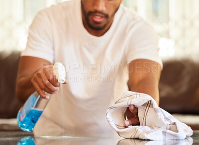 Buy stock photo Man, clean table with spray and cloth, chemical detergent and wipe dirt from furniture. Housekeeping, male cleaner hands with closeup and hygiene, cleaning house with bottle and disinfecting surface