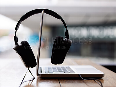 Buy stock photo Laptop, work and headphones closeup on table at cafe or coffee shop for productivity online. Internet, streaming and computer on desk on campus at college or university with technology to study